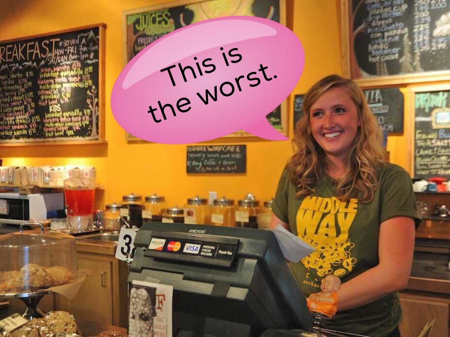 Woman cashier with thought balloon reading "This is the worst."